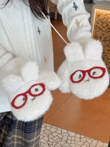 Close-up of white plush mittens with cute bunny face and red glasses, hanging cord detail