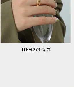 Close-up of minimalist gold H-shaped open ring worn by model in elegant business attire