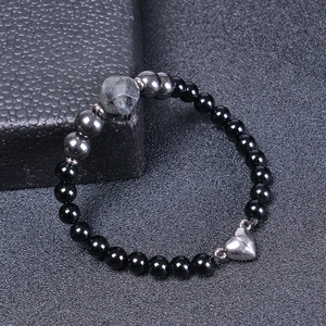 Detail of 6mm black magnetic beaded bracelet with faceted natural stone and heart clasp