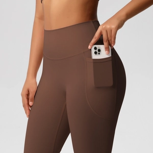 Coffee brown high-waisted yoga leggings with side pockets in stretch matte fabric