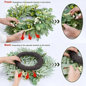 Front and back views of an artificial olive leaf wreath with white berries and vine base