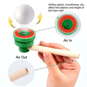Wooden watermelon blowing pipe toy for children balancing a white foam ball