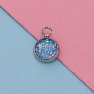 Macro detail of 12mm stainless steel pendant tray with shimmering blue resin filling