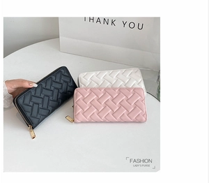 Detailed view of women long purses with diamond weave texture and gold zipper in three colors