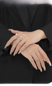 Detailed view of handmade S925 silver rings with opal stone on a model hand