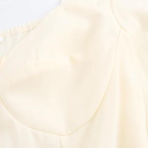 French square neck dress in cream white with tailored bust seam and button detail