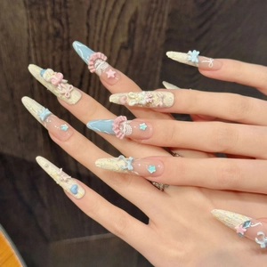 Kawaii press-on nail set featuring 3D rabbit ears, lace patterns, and pearly accents