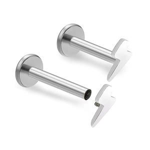 Macro detail of silver F136 titanium lightning labret stud with flat back screw threading