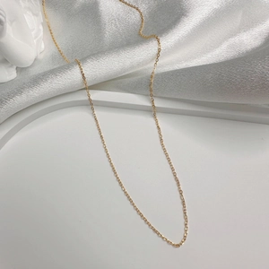 Elegant gold-plated S925 silver O-chain necklace on luxurious silk fabric