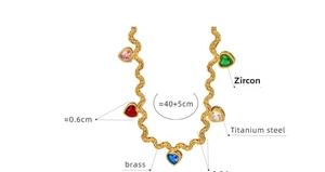 Detail of 40+5cm gold wavy chain with five colorful heart zircon pendants in brass
