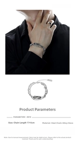 Detail of silver double-layered chain bracelet with grey rectangular gemstone pendant