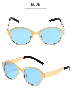 Détails de lunettes de soleil ovales en métal avec verres bleus et monture dorée