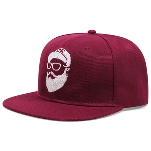 Close-up of white embroidery detail on a burgundy snapback hip hop baseball cap