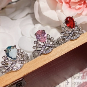 Three crown-shaped rings with pear-cut gemstones in 18K gold plated settings