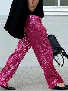 Fashionable rose pink sequin wide leg trousers for women in a stylish outdoor street view
