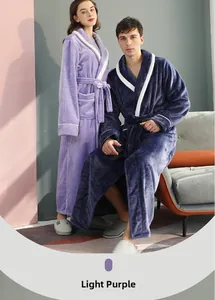 Detailed close-up of matching plush flannel robes with shawl collar and contrast piping