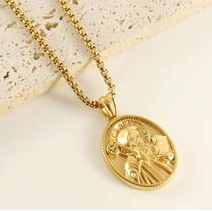 Close-up of 3D St. Benedict religious pendant in 18k gold-plated stainless steel finish