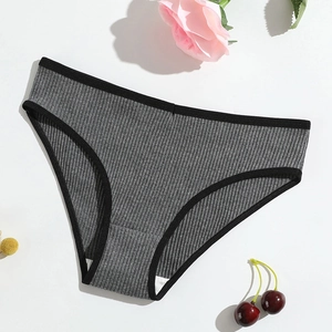 Detail shot of gray ribbed cotton panties with black elastic trim and soft texture