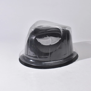 Close-up of black plastic hat shaper insert for caps inside transparent vacuum packaging