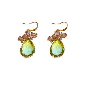 Elegant gold drop earrings with yellow-green main stones and pink floral accents