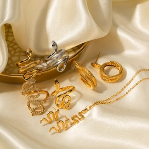 Elegant 18K gold-plated snake jewelry set featuring earrings, rings, and necklace set