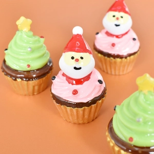 Japanese style resin Christmas figurines featuring Santa Claus and tree cupcakes on orange base