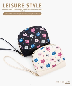 Detail of semi-circular bear print wallets in black and beige with wrist straps