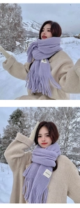 Detail of light purple knit scarf with fringe and handmade label against snowy backdrop