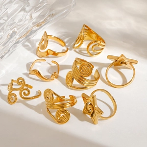 Set of 8 minimalist gold stainless steel rings with spiral and wave hollow designs
