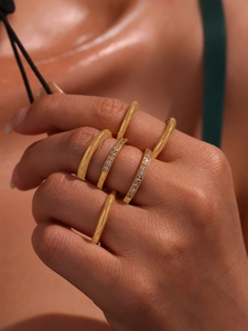 Macro shot of 18K gold plated stackable rings set with CNC 5A zircon details on hand