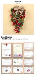 Macro detail of Christmas swag featuring red gold ornaments pine cones and burlap bow