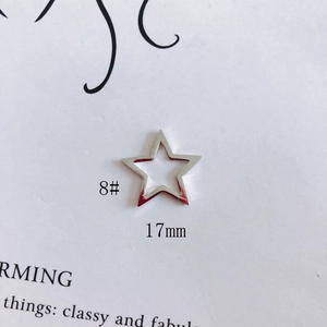 Macro shot of 17mm hollow star pendant accessory in polished silver finish for DIY jewelry