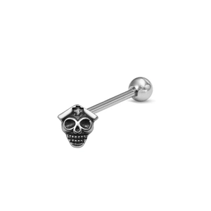 Macro detail of skull tongue ring showing intricate carving and polished metal surface
