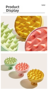 Detailed view of three biodegradable scalp massage brushes in pink, green, and yellow colors