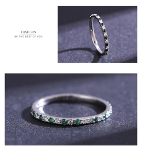 Detail of S925 sterling silver rings with colorful cubic zirconia in a stacked layout