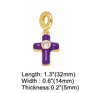 Macro view of purple enamel cross pendant with gold plating and zircon center inlay