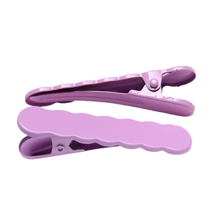 Pair of purple wave-shaped metal hair clips with a smooth electroplated finish
