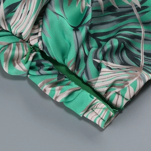 Detail of palm leaf print fabric showing the invisible zipper and fine hem stitching