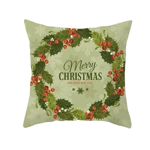 Detailed view of green Christmas pillow cover with Merry Christmas typography and festive pattern