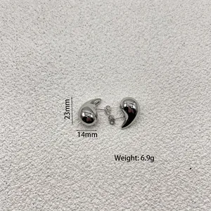 Detailed view of teardrop earrings with dimensions 23mm height and 14mm width