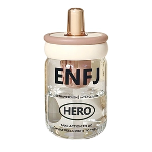 Minimalist high-temperature glass tea cup with pink lid and straw, featuring ENFJ personality print