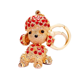 Exquisite golden metal puppy keychain with sparkling red rhinestones for car keys and bags