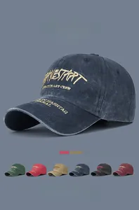 Detail of vintage washed cotton baseball cap with 3D yellow embroidery and color options