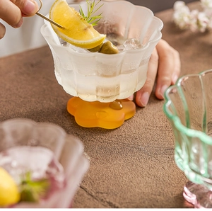 Close-up of frosted petal glass bowl with amber flower base for desserts and drinks