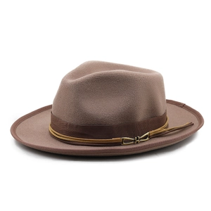 Close-up of brown wool felt jazz hat featuring a decorative band with gold metal buckle