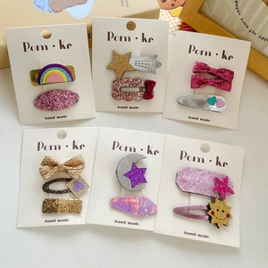 Sparkly sequin bow hair clips set with rainbow and star motifs for girls and kids