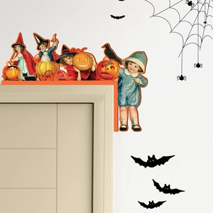 Macro detail of vintage Halloween door corner decor with pumpkin and black cat motifs