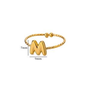 Detailed view of 18k gold plated letter M ring with twisted band and 7mm by 9mm dimensions