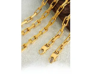 Close-up of polished gold-plated stainless steel Cuban link chain with a lobster clasp