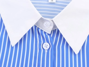 Detail of blue and white striped shirt featuring white contrast collar and buttons